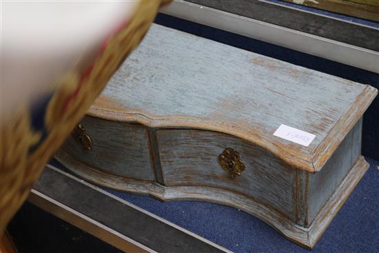 A three drawer serpentine table top cabinet and a woolwork cushion